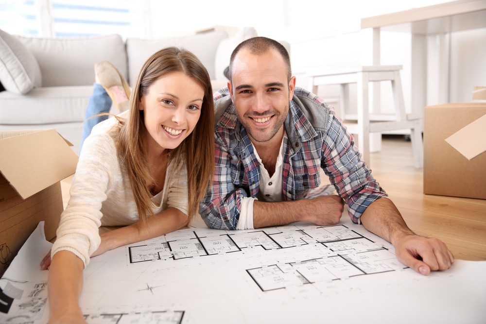 Couple pours over new construction plans