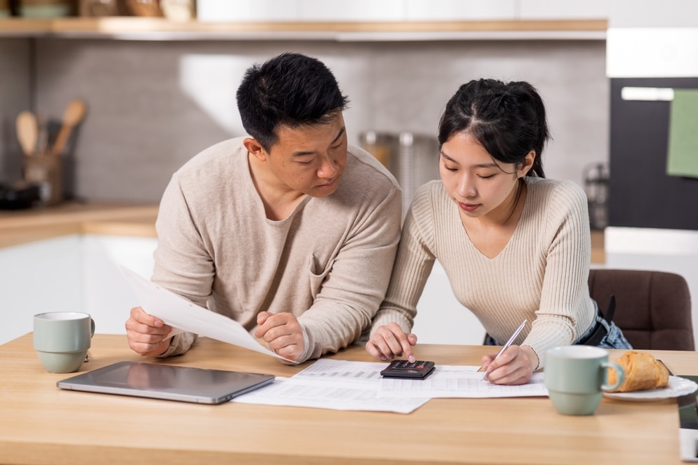 Two people consider whether they should repay their mortgage loan early