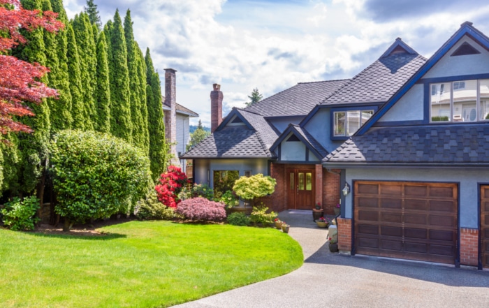 Beautiful home with a garden that's in full summer bloom.