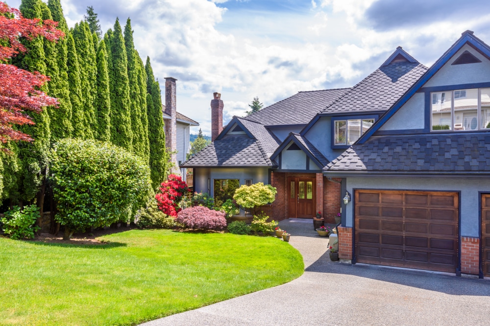 Beautiful home with a garden that's in full summer bloom.