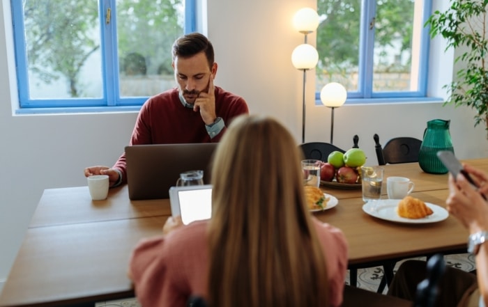 Family members sitting around a table discussing a trust distribution