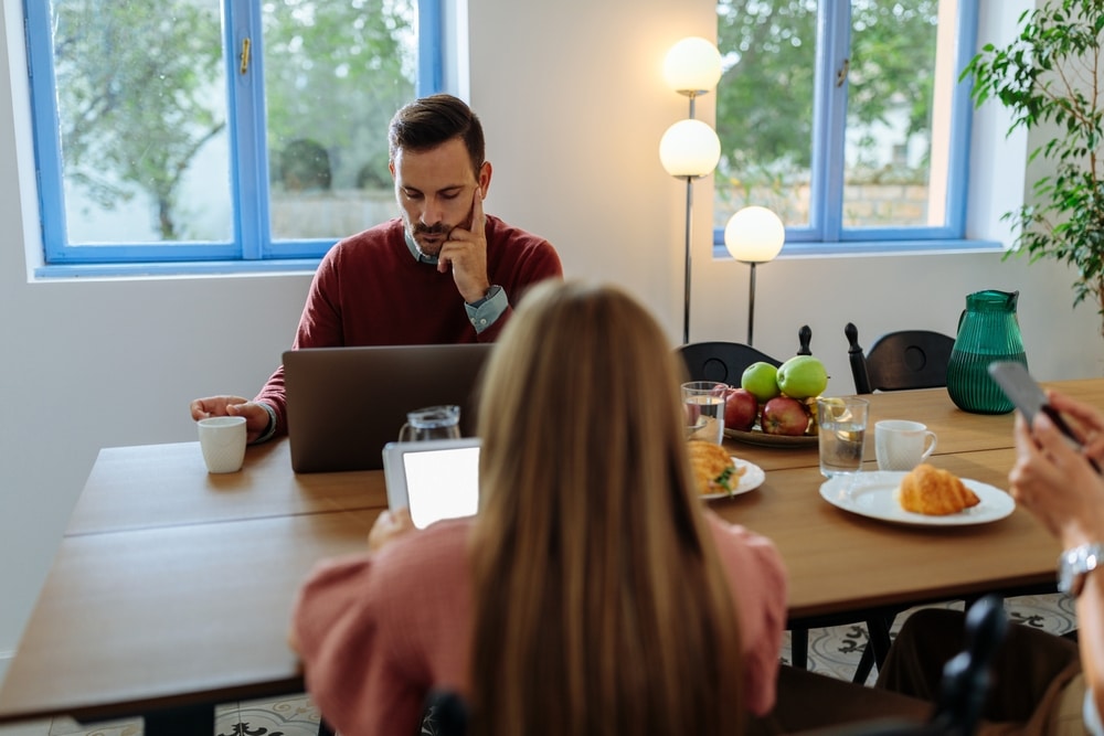 Family members sitting around a table discussing a trust distribution