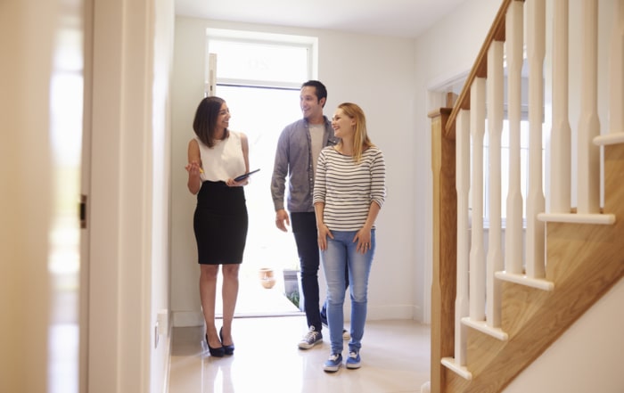Couple walking through a home that had a reverse mortgage