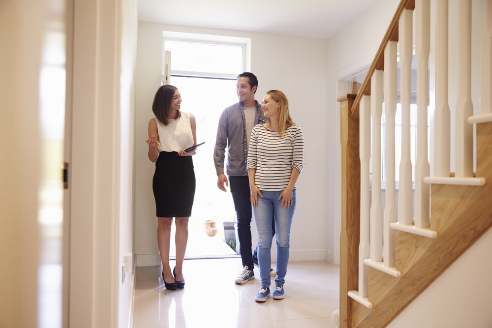 Couple walking through a home that had a reverse mortgage
